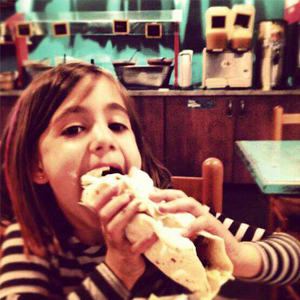 Girl Eating at Blue Coast